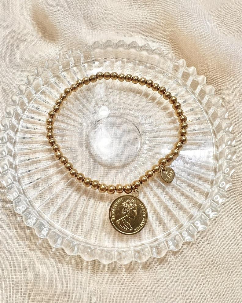 Pulsera elástica de bolitas con colgante