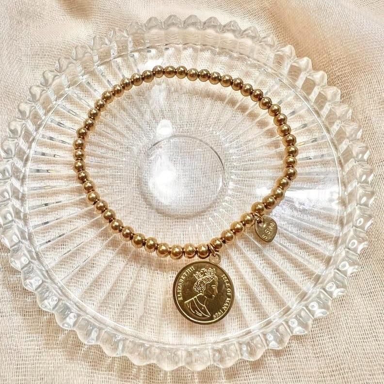 Pulsera elástica de bolitas con colgante