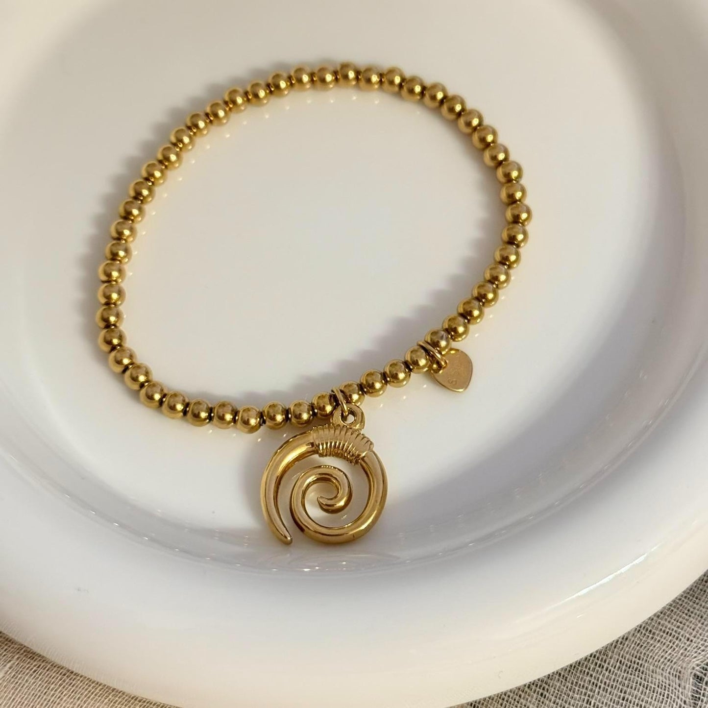 Pulsera elástica de bolitas con colgante