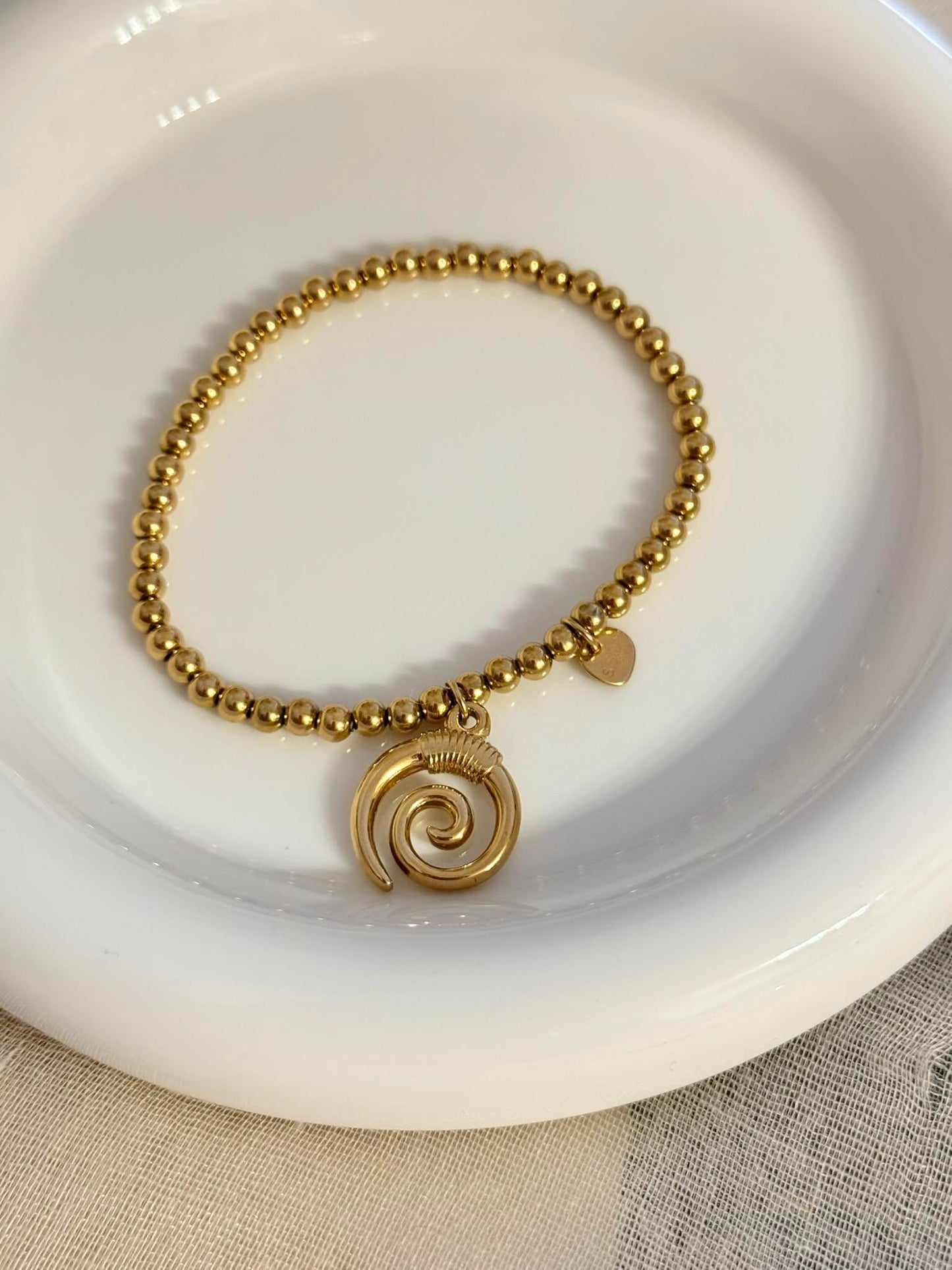 Pulsera elástica de bolitas con colgante