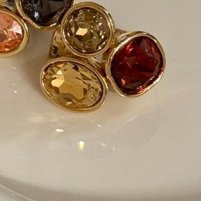Anillo brillante de tres colores ajustable.