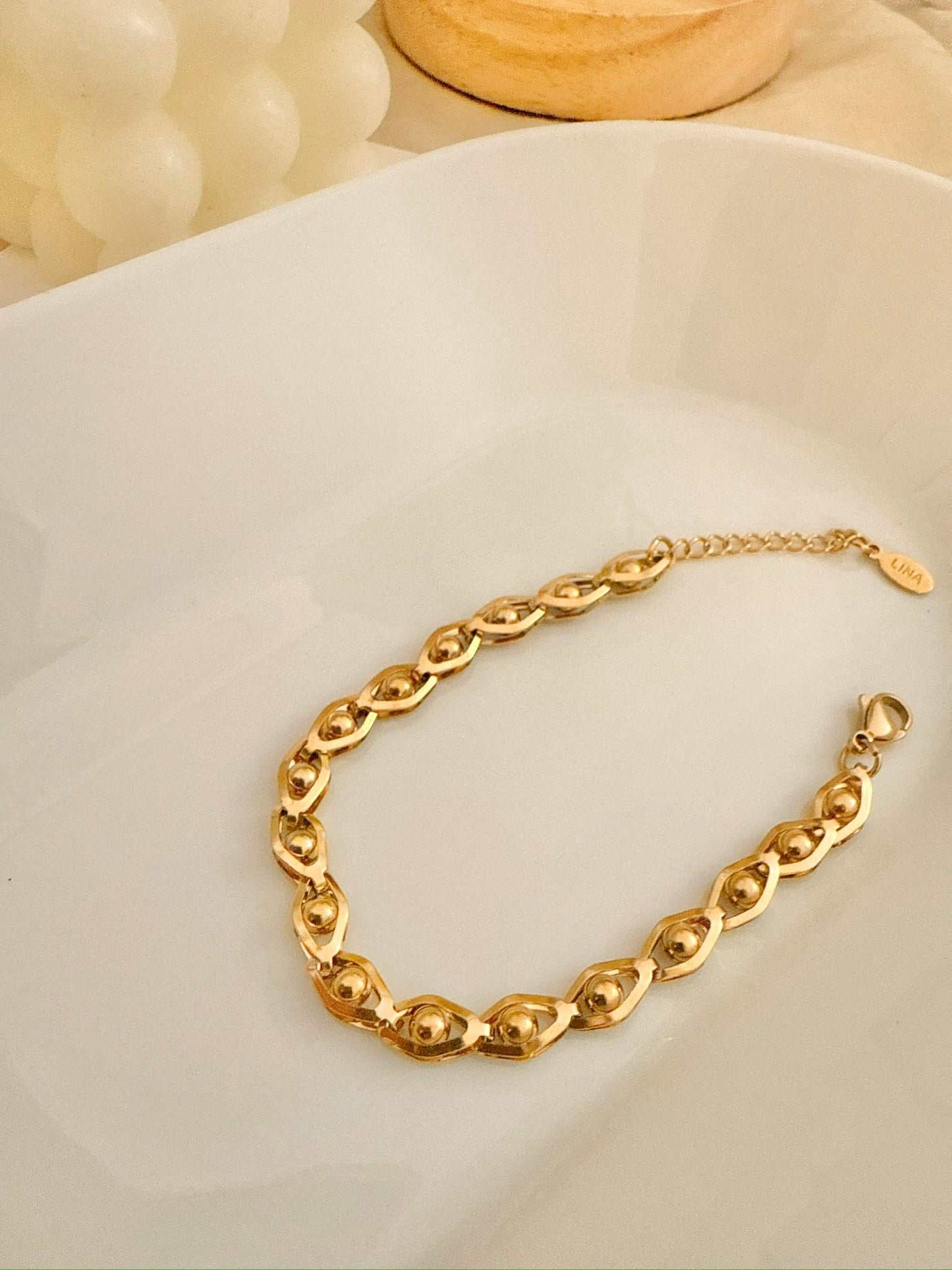 Pulsera cadena ojos dorados